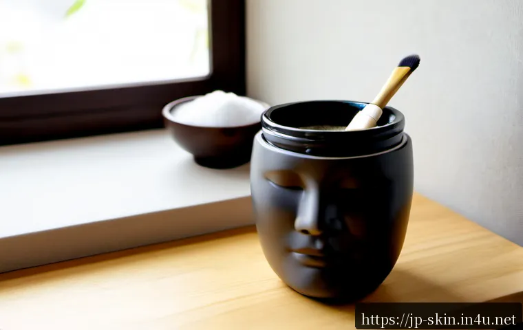 이니스프리 화산송이 마스크팩 리뷰 - Photorealistic beauty review scene, an unbranded charcoal-gray volcanic clay face mask in a plain ma...